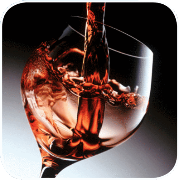 Wine Glass with red wine being poured